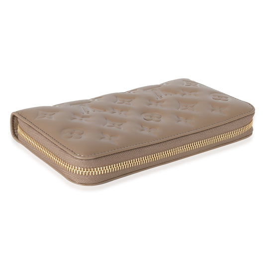 Louis Vuitton Louis Vuitton Taupe Monogram Embossed Lambskin Coussin Zippy Wallet