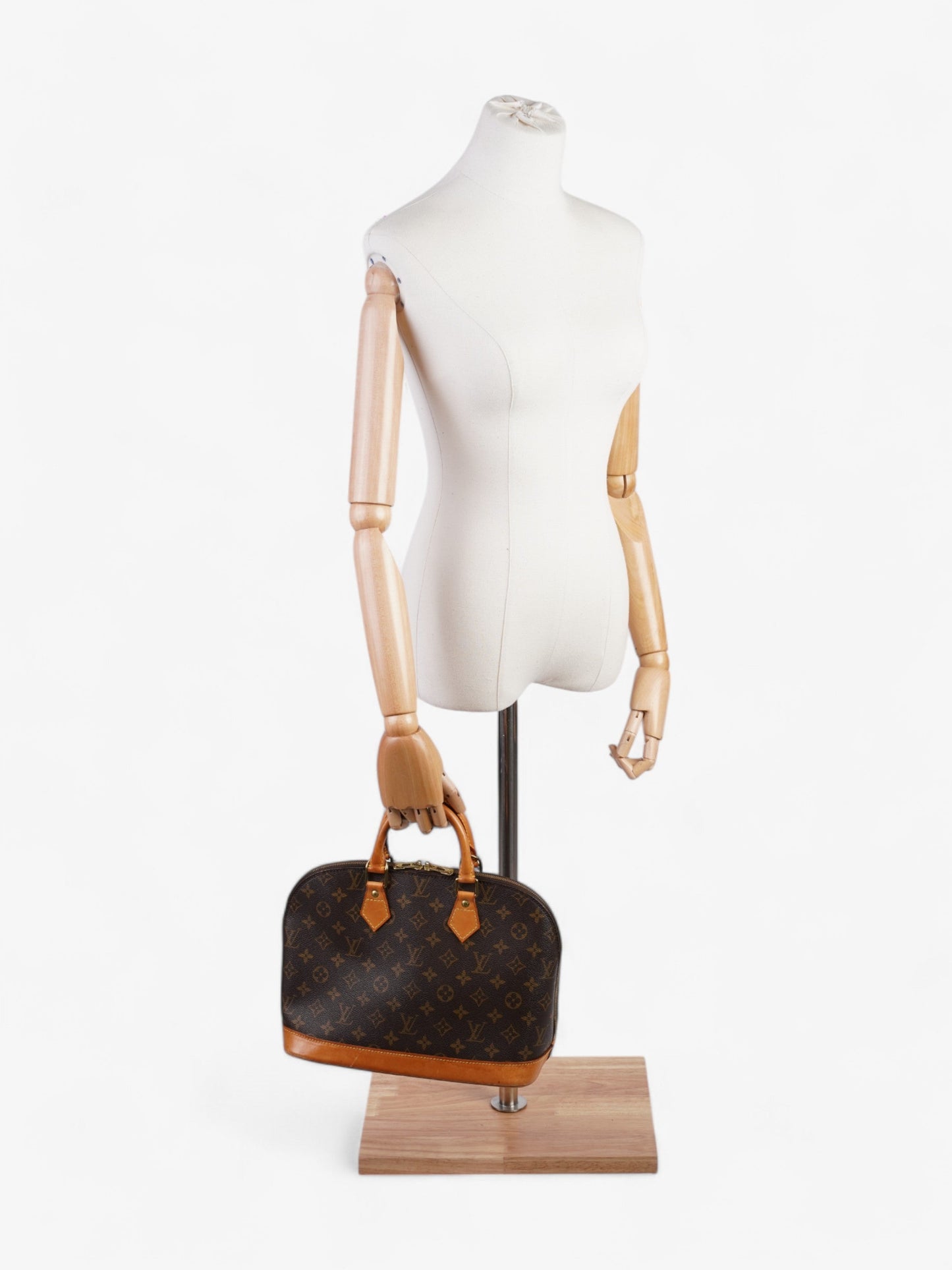 Louis Vuitton Alma Monogram Coated Canvas PM